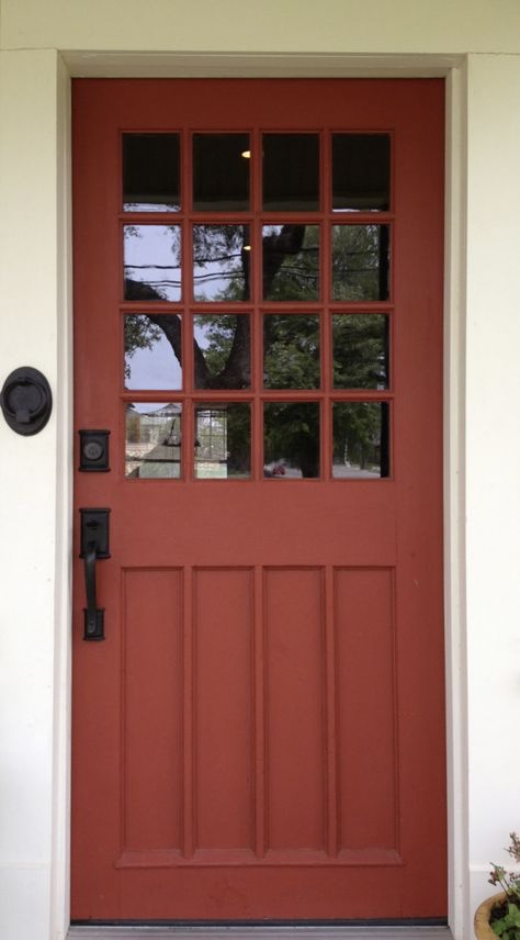 Brick Red Front Door Color, Black And White House Exterior With Colored Door, Rust Orange Front Door, Burnt Orange Door, Red Orange Front Door, Rust Colored Front Door, Red Door Colors, Rust Front Door, Orange Doors Exterior