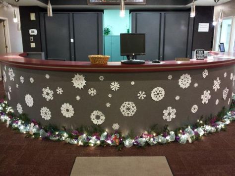 Front desk with snow flakes and garland Christmas Front Desk Decorations, Christmas Decorations For Nurses Station, Front Office Christmas Decor, Nurse Station Christmas Decor, Front Office Christmas Decorations, Halloween Office Decorations Front Desk, Front Desk Christmas Decorations, Reception Desk Christmas Decor, Nurses Station Christmas Decor