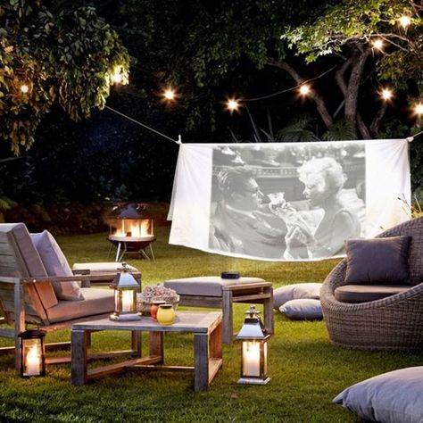 A projector is a great investment for any film-loving family. Warm evening? String a sheet up between two trees and watch a movie while snuggling up under some blankets with a bag of microwave popcorn.   Furniture and accessories from [link url="http://www.johnlewis.com"]John Lewis[/link] Funny Vine, Enchanting Garden, Outdoor Cinema, Backyard Movie, Garden Party Decorations, Have Inspiration, Outdoor Movie, Home Cinema, Garden Parties