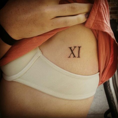 Roman numeral 11 tattoo Roman Numeral 11 Tattoo, 11 Roman Numeral Tattoo, Roman Numeral 11, 11 Tattoo, Roman Numeral Tattoos, L Tattoo, Cute Piercings, Roman Numeral, Piercing Tattoo