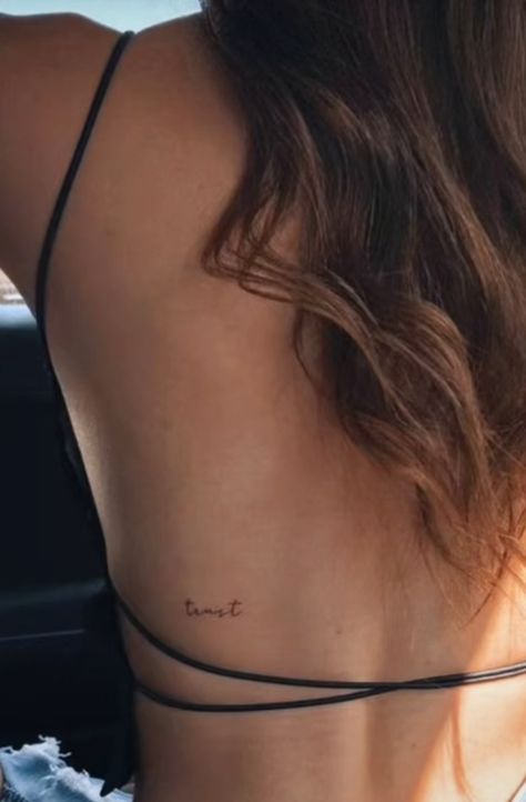 Small Discrete Tattoos, Small Script Back Tattoo, Back Bra Line Tattoo, Tattoo Sur Les Cotes, Script Tattoo Back, Back Word Tattoo, Love Back Tattoo, Word Back Tattoos, Back Lettering Tattoo