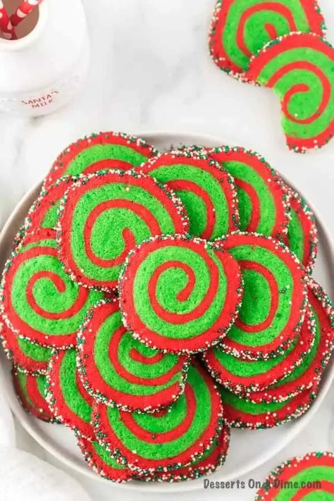 Christmas pinwheel cookies are super easy to make. From holiday parties and more, these easy cookies will be the star and sure to impress. Old fashioned red and green sugar cookies are the best. Make this easy Christmas cookie today. #dessertonadime #christmaspinwheelcookiesrecipe #recipesimple #christmas cookies #xmas Pinwheel Cookies Christmas, Christmas Pinwheel Cookies, Pinwheel Cookies Recipe, Pinwheel Sugar Cookies, Pinwheel Cookies, Best Christmas Cookie Recipe, Pinwheel Recipes, Christmas Sprinkles, Festive Cookies