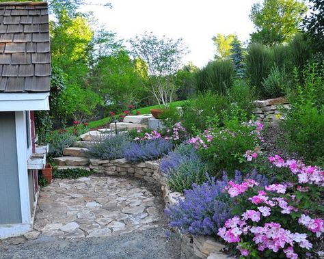 Great use of stone, greenery and pastel shades for this dreamy front yard Colorful Flower Beds, Flower Bed Designs, Hillside Landscaping, Cottage Garden Design, Easy Landscaping, Flower Garden Design, Traditional Landscape, Beautiful Flowers Garden, Garden Cottage