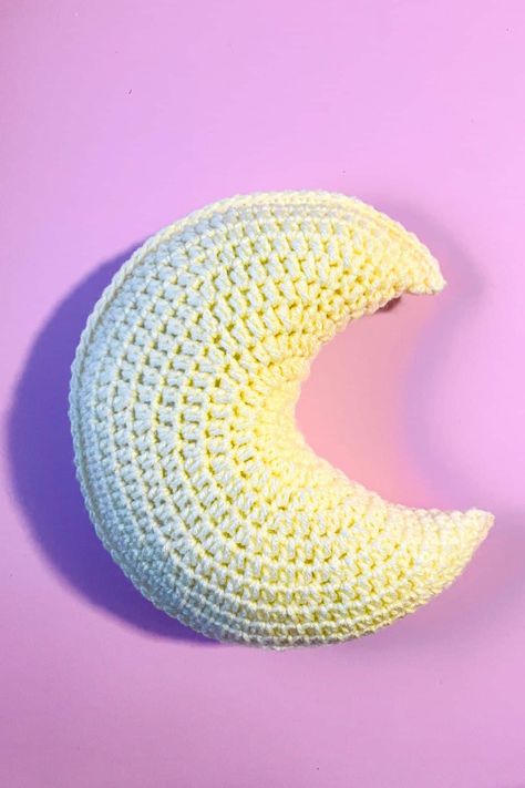 This crochet moon pillow pattern is perfect for snuggling or having on a shelf for a little extra celestial decor. Crochet Moon Pillow Pattern Free, Crochet Moon Pillow Pattern, Moon Pillow Crochet Pattern Free, Sun And Moon Crochet Pattern, Crochet Moon Pillow Free Pattern, Crochet Body Pillow, Moon Pillow Pattern, Crochet Cloud Pillow, Moon Pillow Crochet