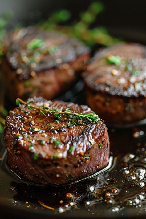 Grilled steak medallions garnished with fresh herbs. Grilled Fillet Mignon Recipes, Cast Iron Must Haves, Stovetop Filet Mignon, Pan Fried Filet Mignon, Marinated Filet Mignon, How To Cook The Perfect Filet Mignon, Grilled Fillet Mignon, How To Cook Filet Mignon In Cast Iron, Best Way To Cook Filet Mignon In Oven