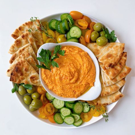 An homage to the Greek dish Htipiti, this whipped feta dip with roasted red peppers is the perfect balance of tangy and savory. With only five main ingredients, this simple dip is easy to make for any small gathering as an appetizer! Try pairing this with toasted pita, fresh crudités, and marinated olives. Red Pepper Recipes, Roasted Red Pepper Dip, Red Pepper Dip, Stuffed Pepper Dip, Marinated Olives, Feta Dip, Whipped Feta, Greek Dishes, Roasted Red Pepper