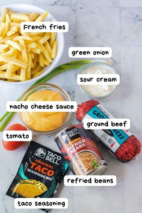 Make Taco Bell's Nacho Fries Supreme at home with this easy copycat recipe! Use fries as the base for your nachos and add ground beef, refried beans and cheese sauce. Satisfy your Taco Bell cravings at home with this easy recipe. Nacho Fries Ground Beef, Fries Supreme, Taco Bell Nacho Fries, Spicy Fries, Ground Beef Nachos, Taco Beef, Copycat Taco Bell, Bean Nachos, Beans And Cheese