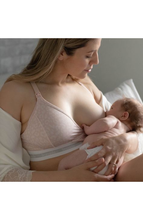 This racerback bra offers exceptional comfort for pregnant or nursing mothers in a sustainable, soft blend for all-day support. Snap-down soft cups provide easy one-handed access. 49% organic cotton, 32% Tencel® modal, 19% spandex Tencel modal is a sustainably produced fiber made with closed-loop processing and is certified with the EU Ecolabel as having a low environmental impact throughout the entire lifecycle Machine wash, line dry Imported OEKO-TEX®–certified materials free of harmful substa Postpartum Belly Wrap, Postpartum Tummy, Post Partum Belly Wrap, Hospital Gowns, Belly Wrap, Post Partum Outfits, Postpartum Belly, Hospital Gown, Nursing Mother