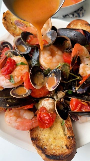 Giovanni Siracusa on Instagram: "🐚 Sautéed Mussels, Clams, & Shrimp 🍤  **Ingredients:** 🐚 1 lb Mussels 🦪 1 lb Clams 🍤 1/2 lb Shrimp 🧄 1 clove Garlic 🫒 4 tbsp Olive oil 🌿 Parsley 🍅 Handful of Cherry tomatoes 🧂 Salt to taste 🍷 Splash of White wine  👨‍🍳**Instructions:** 1. Heat olive oil in a pan. Add garlic and a stem of parsley. 🧄🌿 2. Let the garlic and parsley infuse the oil with flavor. 🔥 3. Add mussels, clams, and halved cherry tomatoes to the pan. 🍅🐚🦪 4. Once the mussels and clams open, add the shrimp. 🍤 5. Splash in some white wine and cover the pan for a few minutes to cook the shrimp through. 🍷 6. Serve hot with a side of crusty bread. 🥖  ✨ Perfect with a glass of chilled white wine!🍷  🇮🇹Buon Appetito!  #seafood #clams #shrimp #mussels #seafoodlover #summerre Seafood Dinner, Soup And Sandwich, Fresh Seafood, Crusty Bread, Seafood Dishes, Dinner Tonight, Mediterranean Recipes, Cherry Tomatoes, Seafood Recipes