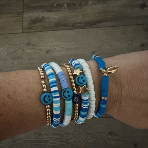 Homemade Stackable Bracelets. Smiley Face Friendship With Evil Eye And Shell. Blue And White Themed 2 Accent Gold Beaded Brackets As Well Set Of 7 - Can Stack In Any Order Or Rotate So Brad Isn’t Showing ** Custom Order Upon Request Check Out Other Listings For Bulk Shipping Trendy Summer Bracelets 2023, Blue Bracelet Ideas Clay Beads, Clay Beads Friendship Bracelet Ideas, Flat Bracelet Ideas, Blue And White Clay Bead Bracelets, Clay Bracelet Stack, Clay Friendship Bracelets, Blue Bracelet Stack, Turtle Clay Bead Bracelet