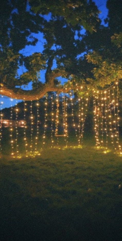 Add a cozy ambiance with string lights draped over trees, fences, or pergolas. Outside Night Lights, Fairy Light Party Ideas, Lights For Partys, Outdoor Night Party Ideas, Graduation Party Lights, Fairy Lights Porch, Fairy Lights Picnic, Fairy Light Birthday Decor, Camping Fairy Lights