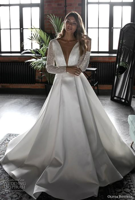 Modern Wedding Dress With Sleeves A Line, Plunge Neck Wedding Dress With Sleeves, Stain Wedding Dress Long Sleeve, Long Sleeve Deep V Wedding Dress, Deep V Wedding Dress With Sleeves, Olivia Bottega, Long Sleeve Sparkly Wedding Dress, Sparkly Long Sleeve Wedding Dress, Long Sleeve V Neck Wedding Dress