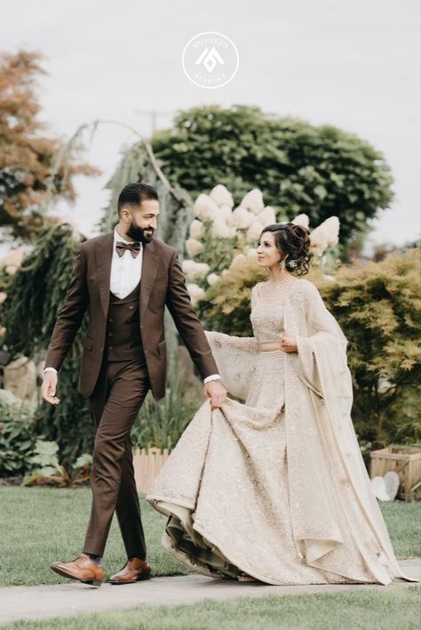 Groom in a three piece chocolate brown Modello suit with the bride complimenting in a beige lehenga. They're giving couple goals vibes 😍 Wedding Suit Indian, Brown Wedding Suit, Beige Lehenga, Suit Indian, Bespoke Suits, Indian Bride Outfits, Custom Suits, Brown Wedding, Bespoke Suit