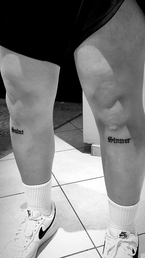 Men Tattoo Lettering, Script Over Knee Tattoo, Sinner Saint Tattoo Design, Saint Word Tattoo, Leg Word Tattoo Men, Text Knee Tattoo, Saint Tattoo Word, Tattoo On Legs For Men Ideas, Words Leg Tattoo