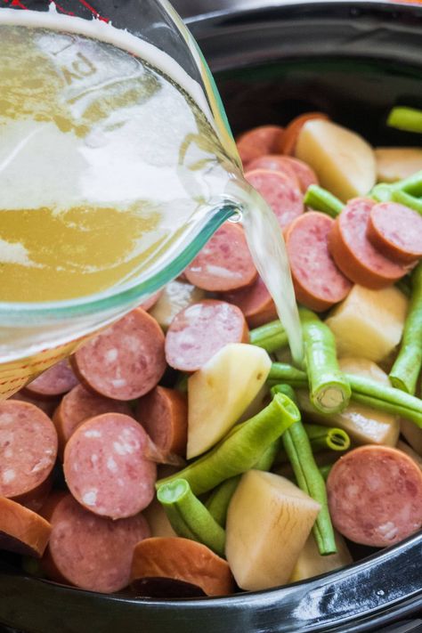 Easy to make crockpot green beans, potatoes and Kielbasa recipe, ready in 4 hours. Simply add everything to the slow cooker and enjoy! Crockpot Green Beans And Potatoes Smoked Sausages, Slow Cooker Sausage Potatoes Green Beans, Green Beans Kielbasa Potatoes, Crockpot Kielbasa And Green Beans, Crockpot Green Beans Sausage Potatoes, Sausage Green Beans Potatoes Crockpot, Kielbasa Potatoes Green Beans, Crockpot Kielbasa And Potatoes, Kielbasa And Green Beans