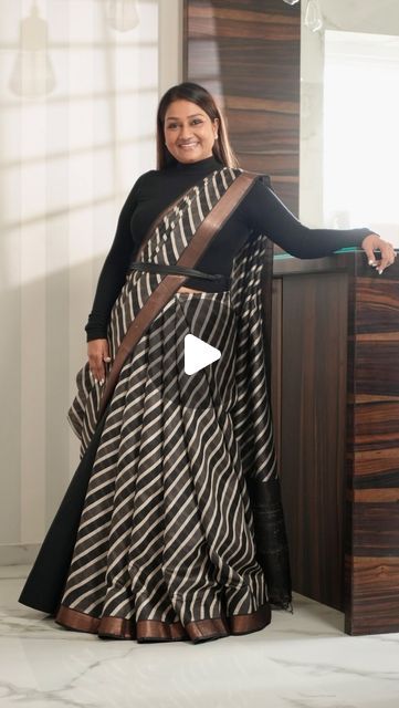 Dolly Jain 🇮🇳 on Instagram: "#SAREELS 425
The reel you’re watching today has a special story behind it. Every reel I create has a message related to a saree, a moment, or an emotion.

About a month ago, I received this saree but due to my constant travel, I didn’t have the chance to open and appreciate it until the day before the shoot. When I finally took a look at it, I instantly fell in love with the fabric and texture. That’s when I decided to try something different with it instead of the usual drape. I opted for a unique D’Coat bell style.

It was a fun experience draping this saree with the D’Coat bell. The first shot in the reel was actually taken without me noticing, as I was completely absorbed in the music playing in the background.

Every saree has its own story to tell, and Sarees With Dupatta, Saree Drape Dress, Unique Saree Draping Style, Unique Ways To Drape Saree, Two Saree Draping Styles, Saree With Dupatta Draping, Saree With Coat, Dolly Jain Saree Draping, Unique Saree Draping