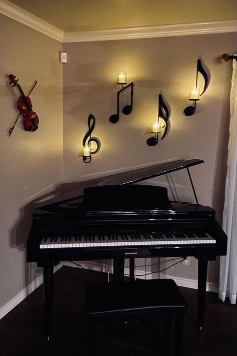 Violin and music note candle holders hung on wall behind microgrand digital piano. Wall Piano Decor Ideas, Music Furniture Design, Digital Piano Decor, Piano In Bedroom, Musician Room Aesthetic, Music Room Ideas Decor, Aesthetic Music Room, Piano Decorating Ideas, Music Bedroom Ideas