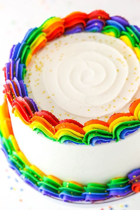 Rainbow Swirl Cake made with three layers of homemade rainbow cake, then decorated with rainbow swirl frosting around the edges! An amazing birthday cake! #rainbow #cake #rainbowcake #rainbowdessert Pride Birthday Cakes, Pride Cake Decorating, Rainbow Swirl Cake, Swirl Frosting, Rainbow Icing, Rainbow Kingdom, Kids Birthday Party Cake, Cake Rainbow, Rainbow Desserts