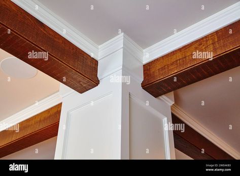 Elegant Crown Molding and Wooden Beam Detail - Interior Design Perspective Stock Photo - Alamy Wood Beams On Ceiling With Crown Molding, Crown Molding With Beams, Ceiling Beam Decoration Ideas, Wood Beams With Crown Molding, Beams With Crown Molding, Interior Design Perspective, Painted Beams, Ceiling Classic, Wood Crown Molding