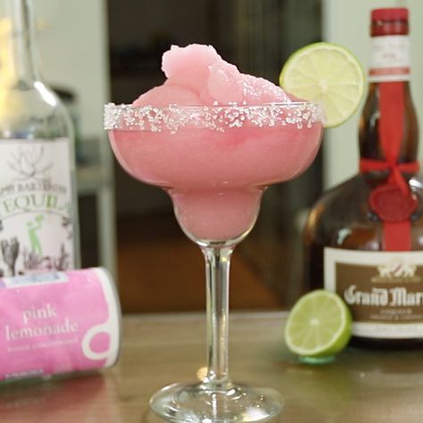 Ladies and gentlemen, this Frozen Pink Lemonade margarita is one of the prettiest, sweetest variations on the classic margarita ever. To make it, just combine tequila, Grand Marnier, and frozen pink lemonade, and bang, you have one of the most delicious slushy cocktails ever. Garnish with coarse salt and a lime wheel for some extra tropical flavor enhancements.