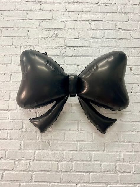 Bows are trending! Elevate your decor with our classic bow design in sleek matte black. Fill with air or helium. 40 inches Black And White Bow Party Theme, Black Bow Baby Shower Theme, Black White Bridal Shower Ideas, Black Balloon Centerpieces, Black Tie Decor, Black Bow Birthday, Black Bow Party, Black And White Party Aesthetic, Balloons On Ceiling