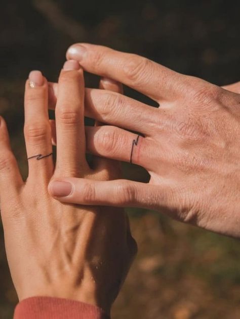 Ditch the Rings: 21+ Badass Wedding Ring Tattoos That Say “Forever" Thumb Ring Tattoos Women, Tattooed Wedding Bands, Tattooed Wedding Rings, Wedding Ring Tattoo Ideas For Women, Ring Tattoo For Men, Marriage Tattoos Ring Finger, Celtic Ring Tattoo, Marriage Ring Tattoos, Wedding Tattoo Ideas