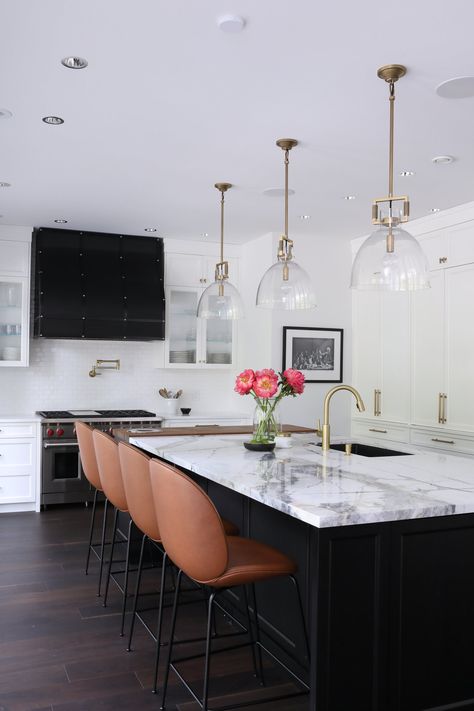 These 12 White Kitchens With Dark Islands Prove Contrast Is Key | Hunker White Kitchen Black Island, Dark Brown Floor, Gorgeous White Kitchen, Dark Wooden Floor, Kitchen Island Tops, Contemporary Style Kitchen, Grey Kitchen Island, Black Kitchen Island, White Kitchen Island