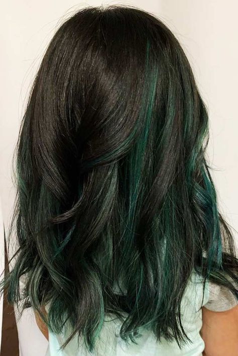 Teal & Black #peekaboohair #blackhair ❤️ Peekaboo hair is a little hint of wild color that can add a lot of character and individuality to your look! Dream about coloring your hair brightly? Dive in our gallery to see how to do it in a modern way: purple streaks for blonde hair, hidden rainbow and galaxy colors under a brown base, dark teal and mermaid ideas, burgundy highlights for black hair, and ideas for all tastes are here! ❤️ #lovehairstyles #hair #hairstyles #haircuts What Color Looks Good With Brown Hair, Green Peakaboo Hair, Wild Color Hair Ideas, Cute Ways To Dye Brown Hair, Forest Green Peekaboo Hair, Dark Green Hair Peekaboo, Emerald Peekaboo Hair, Dark Green Ends Hair, Peekaboo Hair Color Teal