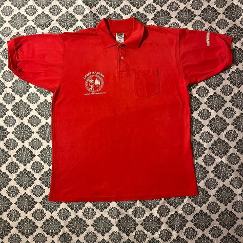 Vintage 90s CampMaster Lincoln Heritage Council Red Preppy Collared Polo

	Size: XL
	Material: Cotton & Polyester
Made in: USA
	Flaws: Stains throughout the bottom front of polo
		
[Measurements in Inches]
Chest: 24
Shoulder Width: 22
Sleeve: 11.5
Length: 31.5

#vtgpreppy90s #vintageprep #vintagepreppy90s #vtgredpolo #vintage90s
------
All measurements are taken with the items laid flat.
Extra pictures are available at request.
Vintage clothing items may fit differently compared to modern sizing.
All items are washed before shipping unless they have tags.
All items come from a house that shares space with a cat, but our cat does not visit the closet.
Don't be shy, offers are always welcome. Red Preppy, Vintage Preppy, The Closet, Men's Polo, A House, A Cat, Vintage Clothing, Clothing Items, Vintage 90s