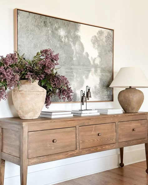 This new sideboard needs a moment! It is an heirloom piece! Ahhh I am in love! And the deep drawers for storage are amazing! It is that piece that you will keep forever! It is also comes in a gorgeous dreamy black! It is the perfect piece for a living room, dining room, or even an entryway. ⠀⠀⠀⠀⠀⠀⠀⠀⠀⠀⠀⠀⠀⠀⠀⠀⠀⠀ Shop all the links for this space in my LTK shop ❤️ ⠀⠀⠀⠀⠀⠀⠀⠀⠀ ⠀⠀⠀⠀⠀⠀⠀⠀⠀ ⠀⠀⠀⠀⠀⠀⠀⠀⠀ #sideboard #consoledecor #consolestyling #consoletable #livingroomdecor #livingroomfurniture #entrywayt... Rustic Sideboard Decor, Sideboard Decoration Ideas, Entryway Credenza Decor, Styling A Dining Room Buffet, Styling A Credenza, Dining Server Decor Ideas, Hallway Sideboard Ideas, Decorate Buffet Table In Dining Room, Sideboard Styling Decor Ideas