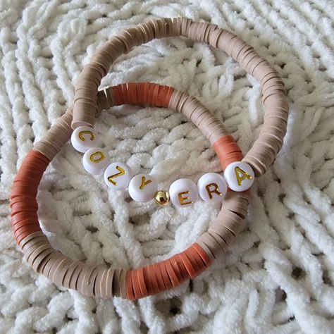 🍁 The listing is for the Cozy Era themed bracelet Set. These beauties can be worn by themselves, or as a stack! My bracelets are made with premium materials, including 18k gold filled bracelets. The Heishi beads are more warm and cozy tones. Pumpkin Spice Latte Set: https://www.etsy.com/listing/1546754711/fall-bracelet-set-pumpkin-spice-latte?click_key=7f5fac8801c4ee81b016cbf3af5b17117fa2fe0b%3A1546754711&click_sum=1a87e5ea&ref=shop_home_feat_4&frs=1 Fall Vibes Set: https://www.etsy.com/listing/1532688082/fall-vibes-bracelet-set-autumn-jewelry?click_key=eda6e5e41ffc8e11e4fd83eb0fb644339ad7afee%3A1532688082&click_sum=b3c30d22&ref=shop_home_active_1&frs=1 🍁All bracelets are FINAL SALE as these are custom orders. Please double check your bracelet size for optimal comfort fit  🍁 CARE INSTRU Fall Halloween Bracelets, Fall Beaded Bracelets Ideas, Preppy Fall Bracelets, Clay Bead Bracelet Ideas Fall Colors, Clay Bead Fall Bracelets, Fall Diy Bracelets, Fall Themed Bracelets, Cute Fall Clay Bead Bracelets, Fall Beaded Bracelet