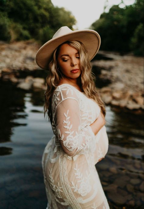 Maternity photos, creek, white dress and hat Maternity Photography With Hat, Satin Maternity Dress Photoshoot, Maternity Photos In Creek, Maternity Photos With Hat, Maternity Shoot Waterfall, Creek Maternity Pictures Couple, Maternity Creek Pictures, Creek Maternity Photos, Maternity Photography River