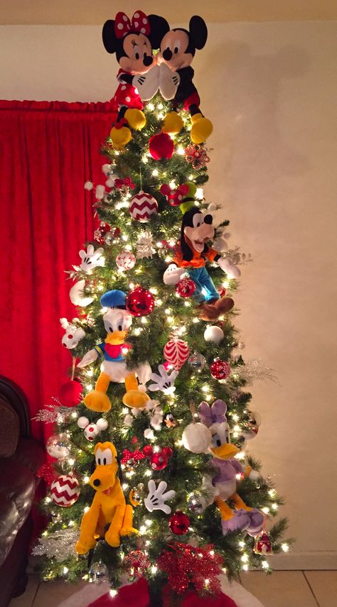 Disney Christmas tree Mickey Mouse Disney Themed Christmas Trees Mickey Mouse, Mikey Mouse Christmas Decorations, Disney Ornaments Christmas Tree, Christmas Tree Ideas Mickey Mouse, Mickey And Minnie Christmas Tree Ideas, Mickey And Friends Christmas Tree, Christmas Tree Ideas For Kids Themed, Diy Disney Christmas Decorations Outdoor, Mickey Mouse Theme Christmas Tree