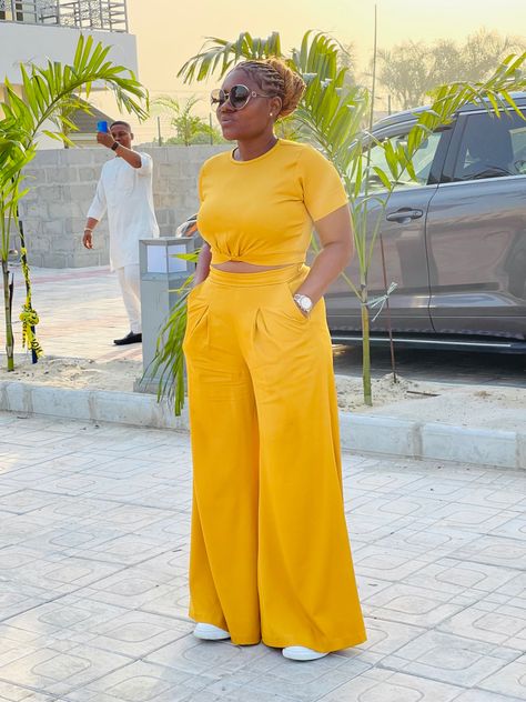 Crop top and a palazzo pants Palazzo Pants Outfit Ankara, Palazzo Pant With Crop Top, Crop Top With High Waisted Pants, Pallazo And Crop Top Outfit, Ankara Crop Top And Palazzo Pants, Pallazo Trouser With Top, 2 Piece Outfit Set Pants Crop Tops, Chiffon Two Piece Set Pants, Palazzo Two Piece Outfit