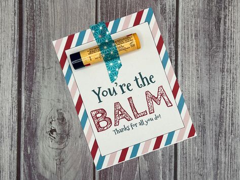 "This is a printable file.  No actual items will be shipped.  Looking for something creative as an appreciation gift?   Add chapstick or lip balm to this tag for something unique!  This listing includes the sentiment, \"You're the Balm.  Thanks for all you do!\"  You will receive one pdf file that includes 4 of the same design per page.  Print these tags on sturdy cardstock and cut them apart for the perfect addition to your chapstick! Attach the chapstick using washi tape or attach it with ribb Chapstick Valentine, Chapstick Gift, Business Marketing Gifts, You're The Balm, Chapstick Lip Balm, Punny Valentines, Appreciation Gifts Diy, Staff Appreciation Gifts, Teacher Appreciation Gifts Diy