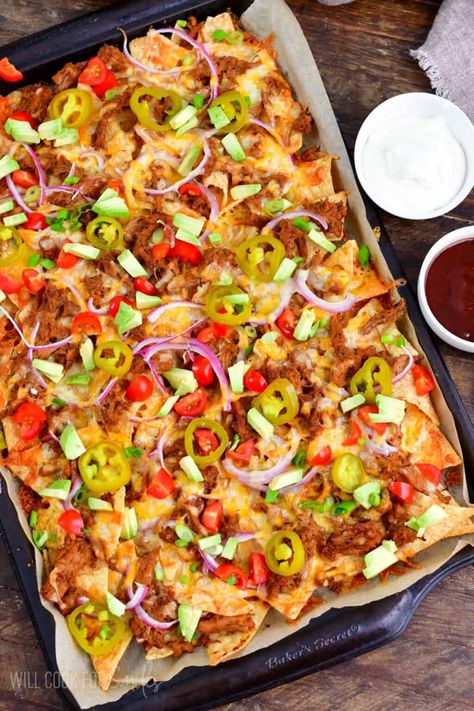 Simple pulled pork nachos where pork is the star. These nachos are loaded with delicious BBQ pulled pork, Colby-Jack cheese, pickled jalapenos, red onion and other fun toppings. Simple dish but it's satisfying every time! Bbq Nachos Recipe Pulled Pork, Bbq Nachos Recipe, Simple Pulled Pork, Pulled Pork Nachos Recipe, Pork Nachos Recipe, Shrimp Nachos, The Best Pulled Pork, Bbq Nachos, Best Pulled Pork