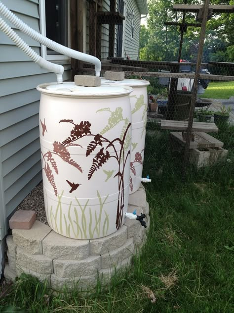 Rain Barrels painted with stencil and exterior house paint Painting Patio Furniture, Rain Barrel Stand, Exterior House Paint, Rain Barrels, Water Barrel, Painted Patio, Rain Collection, Water Collection, Rain Barrel