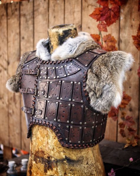 Look like a true warrior with our handmade leather studded armor. Featuring studded leather plates on the chest and an adjustable buckle system for a custom fit. The corded edge and distressed finish add an extra touch of epicness to this unique piece, and will make you feel like a real adventurer.  This leather studded armor is versatile and can be paired with a variety of outfits to create a unique look. Whether you're a cosplayer, larper, or collector, this armor will add an outstanding touch Leather Vest Armor, Leather Chest Plate, Studded Leather Armor Dnd, Leather Armor Fantasy, Leather Armor Pattern, Studded Armor, Norse Armor, Hide Armor, Leather Chest Armor