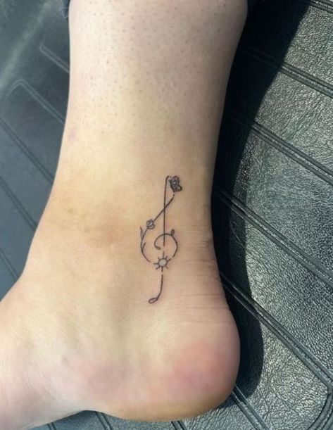 Tattoo Ideas Music Small, Minimalist Tattoo Music Note, Tattoo Ideas Music Unique, Small Musical Tattoos, Music Tattoo Ideas Unique For Women, Tattoos For People Who Love Music, Small Tattoos For Music Lovers, Music Note Flower Tattoo, Music Related Tattoos For Women