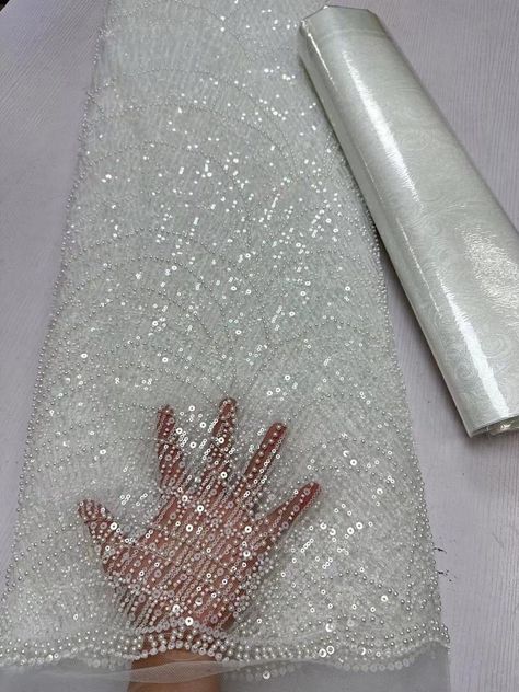 This high quality Fabric is measured in 5 Yards With Embroidered Beading and Sequin. It is soft, very delicate and beautiful. This high Quality Fabric is made with Fashion embroidered rhinestones can be used in making party wedding dresses, skirts, shawls, scarves and other other fashion apparels as you would like. Size : Length : 5 yards (180 inch). Width: 50 inch (Please allow slight deviation for the measurement data ,±1 inch) Material: 100% Polyester, Tulle Lace Fabric, Eco-Friendly embroide Peplum Fabric, Sequence Fabric, Party Wedding Dresses, Hand Beaded Lace, Rhinestone Fabric, Making Fabric, Beaded Lace Fabric, Embroidered Lace Fabric, Luxury Fabric