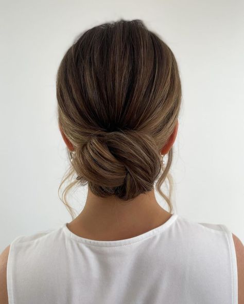 The knotted bun has won the hearts of many 2023 brides this year🫶🏻⁣ ⁣ Let’s carry this look into 2024, shall we?⁣ ⁣ Don’t forget to swipe t… | Instagram Elegant Bun Wedding Hair, Low Buns Bridesmaid Hair, Bun Hair For Wedding, Wedding Hairstyles For Long Hair Low Bun, Wedding Hair Simple Bun, Hair For Wedding Bridesmaid Up Dos, Low Bun Wedding Hair Face Frame, Brown Hair Wedding Hairstyles Updo, Bride Brunette Hairstyles