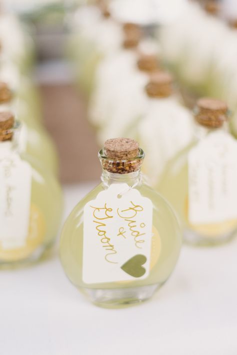 Photography: Michelle Lange - michellelange.com  Read More: http://www.stylemepretty.com/2014/10/24/classic-old-hollywood-glamour-at-highlands-country-club/ Olive Oil Wedding Favors, Backyard Tent Wedding, Olive Oil Favors, Reception Gifts, Favour Ideas, Edible Wedding Favors, Boda Mexicana, Practical Wedding, Ethereal Wedding