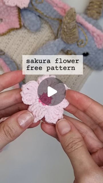 Cassia Mano on Instagram: "🌸SAKURA FREE PATTERN🌸
Mini florzinha de cerejeira bem fofa para decorar o que vc quiser!

#tutorial #flower #crochet #Sakura #handmade #receitagratuita

Sakura
1. 10sc in the MR (10)
2. 10inc (20)
3. [°slst, ch3, tr°, °tr, ch2, skip 1st, slst, tr, ch2, skip 1st, slst°, °2tr°, °tr, ch3, slst°] x5 this are the petals." Sakura Crochet, Sakura Flower, Flower Crochet, Crochet Flowers, Free Pattern, Crochet, Flowers, 10 Things, Pattern