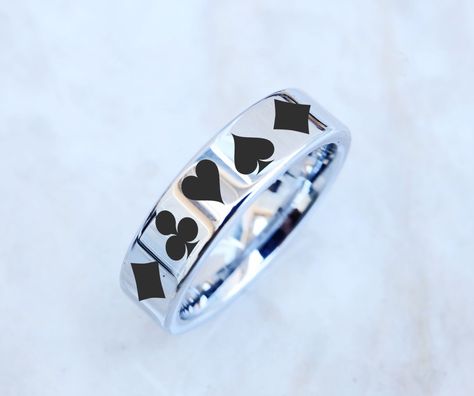 "**Please note any of our engraving designs can be engraved on any ring style within our shop! Send us a message to get started☺️ This is a beautiful one of a kind custom engraved poker ring on our flat ring style! The engraving wraps around the entire ring evenly. This listing is 6mm by default but you can request different at checkout :) ABOUT OUR ENGRAVINGS Our engravings are 100% permanent and are produced with a state of the art laser engraving machine. The color of our engravings are 100% Trans Clothes, Ace Ring, Solitaire Wedding Band, Tangled Jewelry, Star Wedding Band, Engraving Designs, Band Playing, Flat Ring, Star Wars Wedding