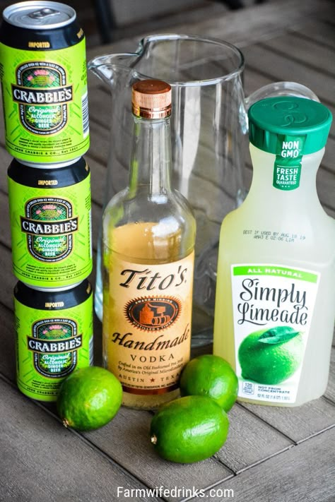 Moscow Mule Punch is the perfect large batch cocktail recipe combining limeade, ginger beer, and vodka great for tailgates, pool parties and BBQs. #Vodka #CocktailRecipe #Cocktails #MoscowMule #Beer #LargeBatchCocktails Moscow Mule Large Batch Recipe, Vodka And Ginger Beer Drinks, Pitcher Moscow Mule Recipe, Large Batch Moscow Mule Recipe, Tito’s Moscow Mule, Large Batch Moscow Mule, Simply Limeade Cocktail, Batch Moscow Mule, Moscow Mule Pitcher Recipe