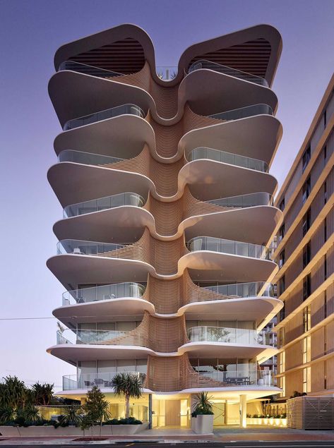 This sculptural and eye-catching building has organic, overlapping architectural curves that resemble the nearby heritage-listed Norfolk Pine Trees. Undulating Architecture, Koichi Takada, Color Exploration, Thesis Ideas, Norfolk Pine, Urban Housing, Passive Solar Design, Timber Roof, Residential Building Design