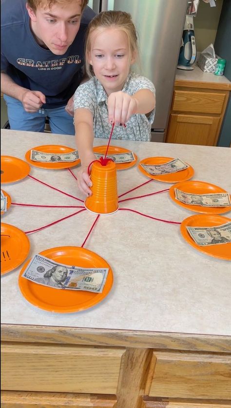 Hot Pepper Roulette 🔥 | prize, Roulette | Hot Pepper Roulette 🔥 Dad and kids play family table game where they pull strings for cash prizes. Hot pepper punishment at the end. This video was... | By Fast, Funny & Funfas | Facebook | Okay, pull a string. Pull a string. $50. $50. Your turn, Kezzy. Pull a string. Here. Do it. Do it. Pull a string. You got it. $100. $100. Let's go. Pull a can. Here we go. Come on. Come on. Come on. And guys, right here is the bad punishment. Oh. It's a hot habanero Egg Roulette Cup Game, Christmas Present Roulette, Cute Prizes For Games, Pull String Prize Game, Family Prizes For Games, Egg Roulette Games, Can Rolling Game, Spin The Wheel Christmas Game, Rolling Can Game