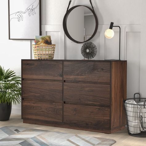 The six-drawer chest comes in a dark walnut finish, offering an intricately finished and visible wood grain that lends heavily to a modern design style.The finish is easy to clean, stain, and scratch resistant making the nightstand an ideal choice… Dark Brown Chest Of Drawers, Dark Wood Chest Of Drawers, Dark House Interior Design, Dark Walnut Furniture, Dark Wood Dresser, Brown Chest Of Drawers, Dark Wood Bedroom Furniture, Dresser Decor Bedroom, Dark Brown Furniture