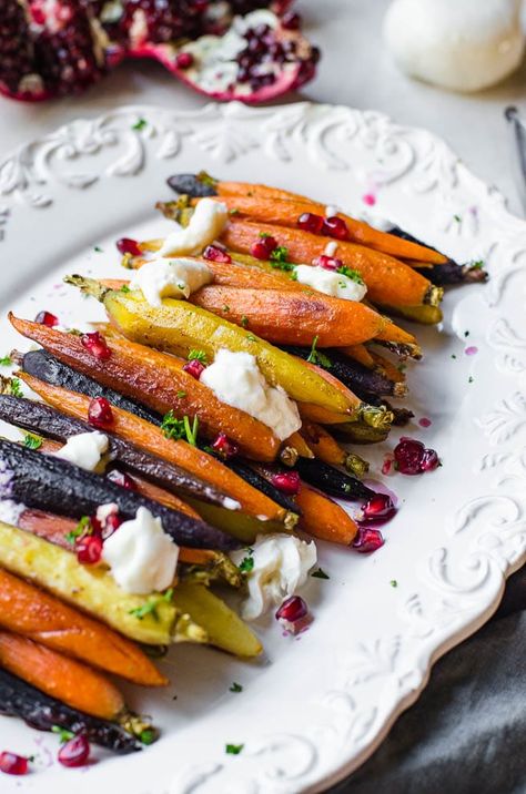 This quick and easy side dish looks so fancy but takes no work at all! These carrots are glazed with a honey cinnamon butter, roasted in the oven, and then garnished with fresh burrata cheese and pomegranate arils. This is a great side dish for Thanksgiving, Sunday dinner, Christmas or just as a fast dinner idea. Plus, everyone loves them! #carrots #sidedish #roasted #recipe #gourmet #honey #butter #pomegranate #autumn #winter #dinner #supper #homemade Menu Birthday Party, Rainbow Carrot Recipes, Starbucks Pumpkin Cream Cold Brew, Pumpkin Cream Cold Brew, Roasted Rainbow Carrots, Winter Dinner Party, Roasted Carrots Recipe, Cream Cold Brew, Honey Roasted Carrots