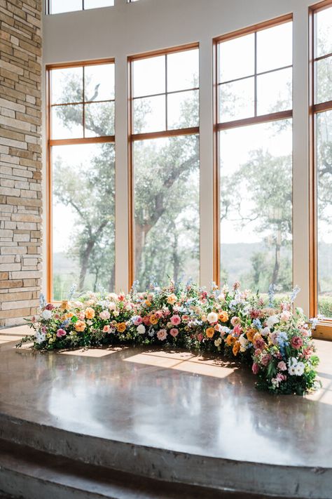 Grounded Crescent Floral Ceremony Arch; ground flower meadow wedding flowers; From the outset, they envisioned a celebration that embraced the natural beauty of a garden wedding flowers setting, with blooms that echoed the colors of a bright summer day. Flower Arch On Ground Wedding, Flower Meadow Wedding Ceremony, Ground Meadow Wedding Ceremony, Floral Arch On The Ground, Ground Arch Floral, Half Circle Ceremony Flowers, Ground Altar Flowers, Wedding Ceremony Floor Arch, Floor Floral Arch